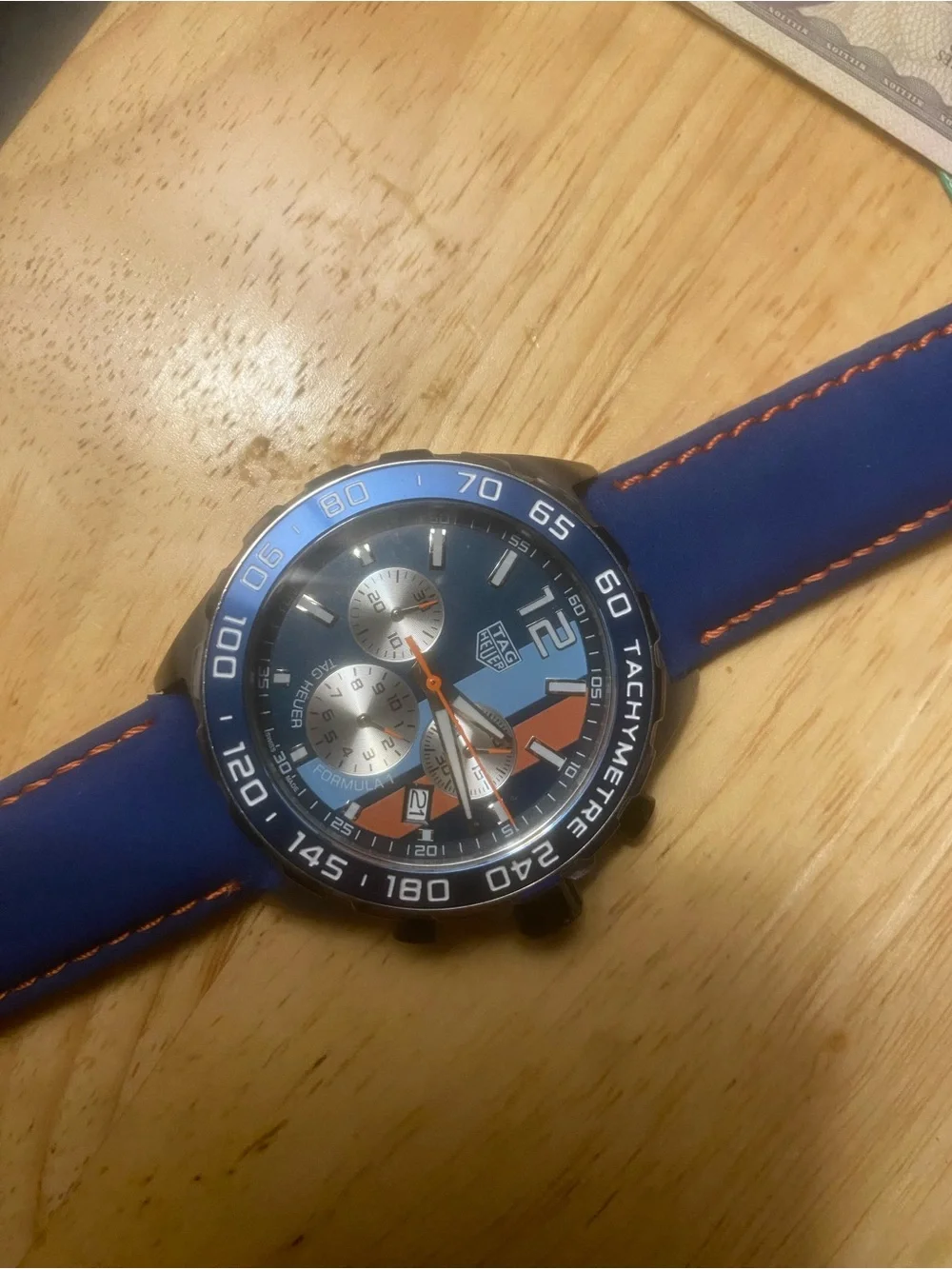 New Tag Heuer Blue Dial Watch with Orange Accents